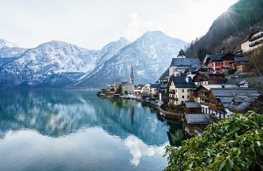 beautiful-shot-small-village-surrounded-by-lake-snowy-hills (1)